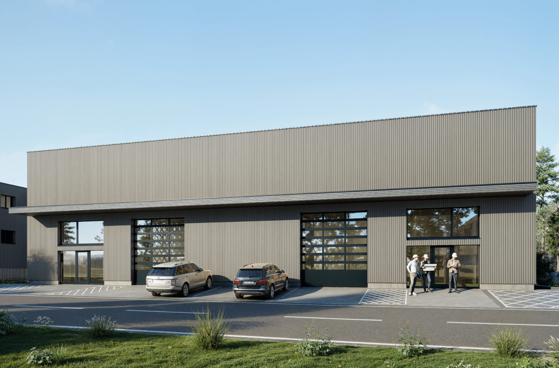 Industriegebäude, Frontansicht mit Hallentoren und Besucherparkplätzen